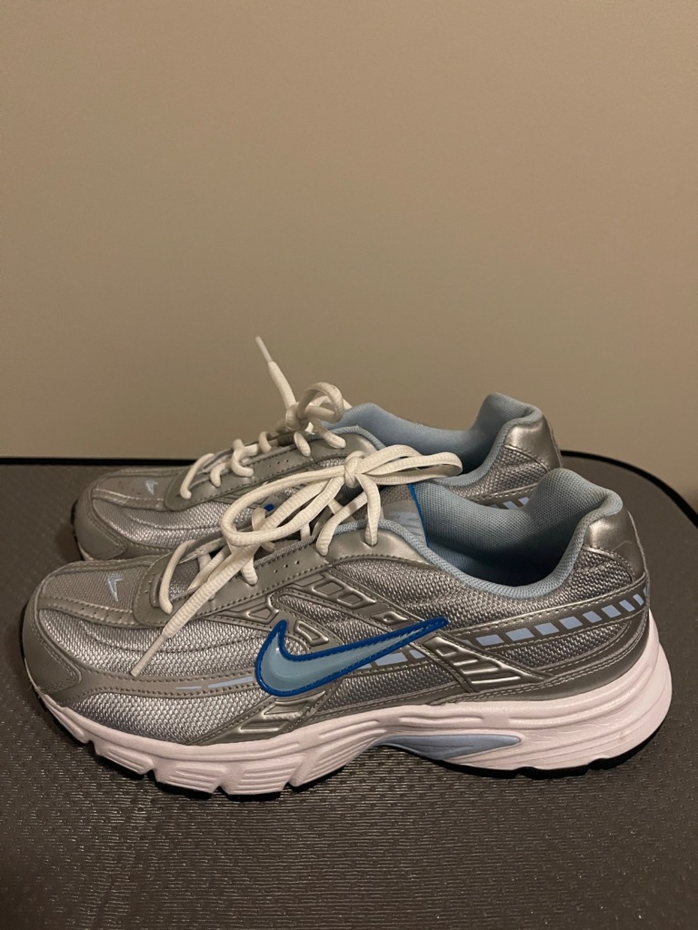 Nike Women's Silver Sneakers with Blue Swoosh